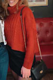 This sweater is fits cropped like shown on the model, is super comfortable and warm. - Nicole R.