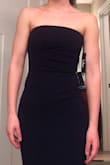 I ordered it in XS, and it fits so well! It hangs right to the floor in heels, and the material is very nice. The waist is fitted and the sash/ bow adds a measure of adjustability. There is a grippy strip at the top that keeps it in place. It is super comfy too! - Ella B.