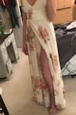 I got both Small and XSmall to try on both. I went with the XS because it fit my chest area better, I could have gone with the Small as well but it was slightly a little bit in the breast area. I love the ties, the slit in the dress, and the button clasp at the chest area. Also, I am 5'7" and wearing 3+ in. heels and the dress just barely hits the floor. Oh and also the fabric is beautiful! Perfect! =) - Jessica U.