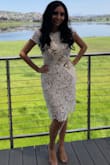 The dress fits perfectly! I intially ordered a medium, but exchanged it for small for a better fit.
Everyone loved my dress! - Andrea M.
