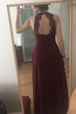 It's a beautiful dress. It looks like on the website picture. I was pleased. The only issue is that it runs large, specially at the bust level. I ordered a size S which is the size I usually wear and it was large on me. Couldnt wear it without adjusting the length and the upper part of the dress at the tailor. The picture are after adjustments were made, and was really pleased with the final result. Would recommend if you are sure of your size. - Melissa C.