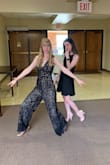 I love jumpsuits, and this one just made my love for them even greater! I love this piece! Easy to move in and wonderful material. I had originally purchased a Small because of my height and viewing previous reviews. Upon receiving I felt like it was too large. It didn't fit larger when it came to the shoulders, but when I lifted it from the back it showed it was significantly larger than I like it. Since I was spending so much money I felt like I should get what makes me feel comfortable. I contacted the return team and the gal that helped me was awesome and took care of me immediately. I returned the product and was quickly able to receive a new size (XS) just in time for the wedding! I paired it with some cute solid color shoes that added a nice pop! Due to my own personal comfort, I felt like the V down the middle was quite low (definitely cute and sexy for certain occasions), but for this particular occasion I had to bring it in, It didn't change the cuteness and sexy appeal of the jumpsuit! Would recommend 100% - Megan S.