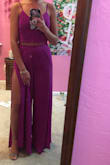 I absolutely loved this jumpsuit, and so did everyone else! I wore petals rather than a bra. The fit was well because you can alter the tightness of the top with the tie strings in the back. The color is an absolute eye catcher! - Mackenzie