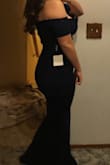 Material is really nice and heavy, but has a little give to it with I found helpful because I have bigger hips and thighs. As a bigger girl this dress was a dream - I thought I might be insecure about my stomach showing but the way the dress is made it all works perfectly! Order this dress! You won't regret it! - Amalia B.