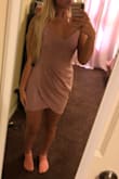 I love the fit of the dress, The material is actually really stretchy even though it doesn't look like it in every picture. I got a Medium and it fits perfect. I will say that it rides up slightly when i'm walking which is kinda annoying, but over fits great and it very flattering. I also love the color and it goes good with black or nude heels. - Abigail L.