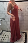 This is a delicate, flowy dress that is really feminine.

Pros: straps are adjustable, buttons on the back are real and are sealed with a snap. Color is close to true (it's a terra cotta/muted rose/rusty rose). Light and airy for warm weather.

Cons: I normally wear a size 4 so I ordered the small. It was too big and ends up making me feel like I'm swimming. Not a ton of support in the chest, either. Going to have to try to get this tailored if I want to keep it because there aren't any XS in stock until 10 weeks from now!! CRAZY! - Anthony S.