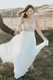 This dress felt and looked so beautiful. It fit really well and the design of the beading was spectacular! It was perfect for my anniversary photo shoot! 10/10 recommend. - LeAnn W.