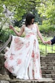 I wanted a gorgeous dress for my engagement photo shoot and I'm so happy with this dress! The button at the bust didn't close, but with some adjusting of the straps, we got it to sit nicely without buttoning. It was a tad long, the bottom is all frayed from being out and about (and I'm 5'10) but I didn't mind the extra length! Gorgeous dress overall and would highly recommend! I was getting so many compliments, I felt like a movie star! :) - Lauren S.