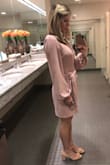 Fits perfect and is the perfect color. I am only 5'3" and I'd say it's on the verge of being too short to wear to work, so beware if you're taller (especially when bending or kneeling). I see that some taller women have ordered, but I personally don't feel it would be appropriate for work if it were any shorter on me. I've gotten so many compliments on the dress though. I just ordered in black so I have one for the winter as I think it would look great with tights! - Ashley H.