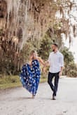 This dress is flowy and beautiful. XS fits perfect and the only reason I gave it 4 stars is because it's a pain to get in and out of due to tie back. I had to get it hemmed as it was very long on me. 2nd pic from photo shoot with Rebecca Fitzgerald. - Susan L.