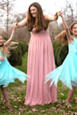 I ordered this dress to use at a photo shoot with my daughters. We wanted something flowy and this was perfect. The only downside would be the top. It's extremely low! I had a hard time finding anything to wear that wouldn't show and since there is absolutely no padding or lining I felt I needed something. So we ended up working around the showing bra with my hair and the angle of the shots. But all in all it was a great dress. I wore wedge sandals and the dress was still long enough to cover my shoes and just drag the ground. - Candice W.