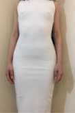 Under size & fit of item, it states, "May be worn with...no bra" hmm...really? I wore no bra and it was definitely a "you need a bra" dress. Material: The fabric IS stretchy which DOES allow for a custom fit, but the material is not worth $49.00. The fabric is body-con material, slightly see-through. I thought it would be thicker where I really did not need a bra, but in the light you can most definitely see my nipples perk out of the dress. The length of the dress goes down too low (past my knees) - would need to be fitted. The inner straps on the top part of the dress got in the way: either keep it attached to the dress and tuck it in or cut off the inner straps completely. 
Body-con/slip-on dress - Yes.

There is a wire on the bottom portion of the back to keep the dress in place. The seams were misaligned on the sides of the dress - one side seam was good - straight; the other side seam was segmented - split.

Pros: LOVE backless - made me feel super sexy; booty was very nicely accentuated.

NOTE: was not wearing any panties (and, obviously, no bra) *As soon as I moved, the dress started to shift and crinkle. I had to keep re-adjusting it to make it smooth again. - Moy Y.
