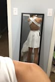 I plan on wearing this dress to my graduation because it is conservative but still has a party in the back. It fits awesome and there is no need to wear a bra with it! I ordered a small and it is a little short but overall it fits very nicely! - Cecilia V.