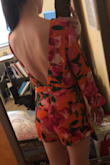 The fit of this romper was weird. The top was really baggy if you weren't standing up completely straight. At the same time the waist was snug. I purchased an XS although my measurements are between a size XS and S. I was disappointed with how loose the top was. - Annie R.