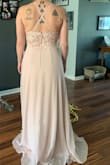 I adore this dress.  It is a very light pink. Absolutely beautiful. Fits perfectly and is great for those who don't want to show cleavage.  However it is very long. - Tess M.