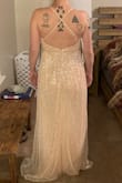 I thought I was going to fall in love with this dress but unfortunately did not. It fit too awkwardly and is more of a peach color than pink. It was huge in the bust area so I tightened the straps as far as they would go but then the top was too high and then the back was too tight. The waist band also didn't fit correctly and wasn't fitted and just hung awkwardly.  This dress really exposes your chest so if you don't want to show cleavage then I wouldn't recommend. However I loved the sparkle and sequins on this dress. The dress it's self is gorgeous just didn't fit me properly. - Tess M.