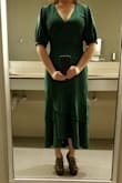 First, I have both the black and green. The M is a spot on fit, and on my height it looks almost Victorian in style. I won't alter the hemline as I think it would ruin the lines. I'm wearing 3 inch heels, but in flats the back hemline barely clears the ground. Love it! - Kelli G.