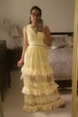Love the color, and love the ruffles such a fun girly dress! The issue is it's sooooo long. I'm 5'4 and I'm wearing my highest heels with platforms and still the dress is dragging on the floor. The way the dress is made not sure how the alterations will go with the ruffles w/o ruining the pattern, but something must be done! Regardless of the sizing experts, if you're not tall I'd opt for another dress unless you're willing to invest more money into it. Also, the zipper is very fragile. - Mara D.