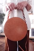 After scouring countless sites for the perfect canteen bag, I stumbled on the Croc n Roll. I've had so many compliments, from the acrylic chain handle to the cognac color crocodile material. It's definitely attention grabbing and I'm definitely in love. Croc n Roll forever. - Elisha D.