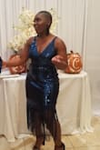 Great dress I ordered a medium. I love that it had some stretch to it. I wore it to a gala I received a lot of compliments. It was a little loose on top because I have bigger hips. - Kettia S.