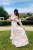 Wore this for my bridal shower and received compliments from every guest. The dress is so beautiful and airy and is such a soft, chiffon-y material you just want to twirl around in it. It's slightly see through, so just be careful with undergarments. - Carina C.