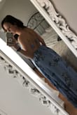 I was a little hesitant to order a floor length dress because of my height, but I ordered a small and it was perfect with my heels! The heels are about 4" tall. It's perfect for my best friend's wedding in May that I will be wearing it to! The tie on the back makes it a good fit for girls with a smaller bust like me. I don't need to wear a bra with it either! - Jessie B.