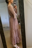 I was SUPER pleased with this dress. I'm a shorty- so this dress is the PERFECT maxi dress on me. I wore this to my brother in laws Spring wedding and I loved it. The colors are a beautiful lavender purple..my ONLY con? It's quite large in my waist area. I do have a very slim waist but I wish it could have been snug in that area for me. Also, I have a small chest so the chest area- thankfully there was a little snap button for closure- but wish there had been more than one snap button.
All in all, a great beautiful dress...! - Kim D.