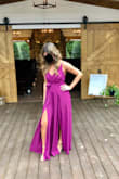 I bought this jumpsuit for a wedding, and once I had the alterations done, not one complaint! I did have to get it hemmed up, even with 4 inch heels it was still pretty long. Then when I zipped the back up the top pulled a little too much for my liking (my waist might be in between sizes, but a medium would have been way too big) so I had my tailor let some of the fabric around the zipper loose and it worked perfectly! The straps are a tight clingy stretchy material that didn't budge one time all night even while dancing. The bust area had me a little worried, as soon as I put it on the girls fit in there perfect! Wasn't a concern at all. Overall, this is my favorite piece in my closet and received so many compliments! - Kaitlyn P.