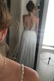 This will be my party dress at my wedding - I received it well in advance. It looks so much better in person, I'm so happy with this choice. The corset runs a little bigger, so I might have to take it in a little bit. It is long as mentioned with a bit of a train but highly recommend. I was originally going to go for a size 10 because my measurements are right in between an 8-10 but I figured I will lose a little weight and I ended up getting the 8 and its even a bit a big, so take that into consideration. Overall very happy! - Leorre F.