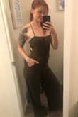 I bought the small and it's perfect! It runs a little long, but nothing a pair of shoes with a small lift can't fix (also works perfect with heels to dress up!). Runs a little loose up top, but that's because I'm not working with a lot. I am used to tailoring a bit to make one-piece outfits work ;) Would 10/10 recommend! - Alyssa L.