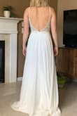 I returned this one. It was beautiful but made me look a little too chesty for my wedding day. It's really gorgeous and great quality. If cleavage is ok for you go for it! It actually has good support and I wouldn't have needed a bra which is a surprise consider my boobs are on the larger side - Caitlin G.