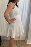 So I got this in hopes it would work for my baby shower! I'm 30 weeks pregnant, usually wear an XS in everything at Lulus and sized up to a M for comfort and length! It fits great but not quite how I hoped. I thought it would be a little more fitted in the belly area... Still soo cute and very comfortable!! Nice thick fabric and not see through at all. - Karlie N.
