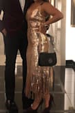 This dress was perfect for my company holiday party. Definitely got some attention and brought the glam which I'm all for. Ordered a small and it fit me perfectly. It is not itchy which is always a possibility with anything sequin, but it was just perfect. Can't wait to wear it again. Highly recommend for your next special occasion! - Carissa K.