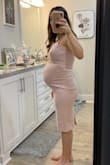 Thinking about wearing this to my up coming baby shower! I'm 31 weeks along and this dress works perfectly! I'm usually a size XS, but went with a Small to support my growing belly lol. Fabric is super stretchy and lots of room! Overall super happy. - Karlie N.