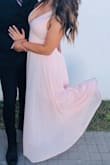 Fit perfect. The V-neck is a little low and I had to wear a bra that dipped lower than regular ones. I also hemmed it two inches to make sure I didn't trip (my heels were only 2 inches). I got so many compliments! - Taylor F.