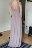 The dress is relatively nice but the material is too heavy. It could also be shorter. - Tamara L.