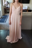 The back of this dress is gorgeous, but it runs large and long. It's a lot more of a soft pink than the picture online! - Bailey C.