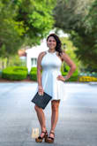 This dress fits true to size! The material is a high quality, heavy material. The material is breathable, so perfect for outside events like graduation! I highly recommend this dress to anyone looking for a dress to a nice event like graduation! - Jordan B.