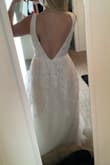 The dress is beautiful but the fit is off. It looks very nice and fitted on the model but it is not right in person. The ribbon at the waistisn't straight and it makes you look kind of wide. - Stephanie B.