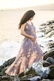 I wore the dress for my maternity announcement shoot, and it looked great!
A bit deeper neck than I would have liked even after setting the straps, but other than that the dress falls very nicely on the curves and blew a little in the wind that made for nicer pictures. :) - Winnie N.