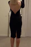 LOVE this dress!! Conservative, but sexy and fairly high quality. The back actually has some boning to help keep its shape. I wore this to a wedding and received many compliments along with one nasty comment from a woman who thought the slit in the back was too high. Majority rules, right? - Amy S.