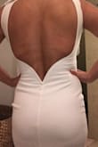 Dress fits perfect material is very nice a little long for me but I am also short so nothing that can't be fixed. - Isela V.