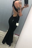 Got this dress to wear to a formal event and the material is great. Not too thick or heavy but still feels nice. It was a little big on me as far as waist and length go, but the material is pretty stretchy so I got it altered to fit me better. Being small chested the v-neck is cute without being too busty. Overall, would get again. (photos attached are when I took it to get altered). - Sierra S.