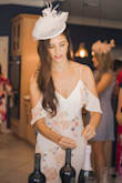 This dress was beyond perfect for my bridal shower! We did a garden style theme & everyone wore fascinators! I did not have it tailored at all. I'm 5'8" and wore a mid-heel & the length was perfect. The adjustable straps were exactly what I needed as I'm on the smaller side in the chest. You will have to use a stick-on bra, as the back scoops a bit. The waist line hit me just right, but not too tight where I couldn't eat & drink! Highly recommend to other brides if you're looking for this style or theme for one of your wedding events! I received so many compliments! - Karen R.