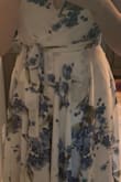 This dress is so pretty, but omg my chest was totally hanging out. Even after taping and retying the dress it was bad. - Kimberleigh R.