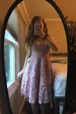 I love this dress. I ordered it for a wedding and it is so great. Tight enough at the bust and flows out at the hips. The only thing I wish was different was the color. In the picture on the website, the dress looks pinker but when I got it, the dress was more of a purple color. Other than that the dress feels very high quality and is absolutely gorgeous! - Michelle O.