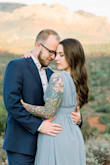 Loved this dress for my engagement photos. The top part of the dress was a little big on me personally; I had the top altered to tighten each strap and close up the deep V about an inch. After it was altered, it fit much better and was perfect. The slit in the side of the dress is very high FYI. - Nicole T.