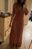 I love love love this dress! the color is beautiful and it's light and flowy for a summer wedding. I want it in every color! I do need to be careful and tie the dress tight since I'm larger up top and the girls are kinda out, overall- great dress!! I bought a small and it fits perfect, doesn't need to be hemmed! - Lisa C.
