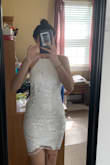 I bought two of these dresses (a small & extra small) for my graduation in June. I tried on the small first, and it was a little baggy. I tried on the extra small, and it fit like a glove. I fell in love with it! It is super hard to zipper on your own. Be careful zipping it because the zipper does get stuck a little along the way because of the embroidery. I am a sucker for the high neck look! The dress is great quality! I would just be careful choosing your undergarments because it is a little see-through even through it is a great thick material. I also put on the cup sticky bra to enhance my boobs so they weren't so pressed! It made it look so much better! - Sierah M.