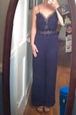 I ordered this for a beach wedding I was in and I love it! The material is good quality and its super cute. I am 5'0 and petite and it fit floor length with a small heal. I think an XS would have fit slightly better but the bigger size was comfortable with the touch of extra room. I love this jumper and will wear it again for sure! The photos are poor quality and don't do the jumpsuit justice. - Molly O.